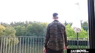 Two muscular guys showing off their muscles EastBoys